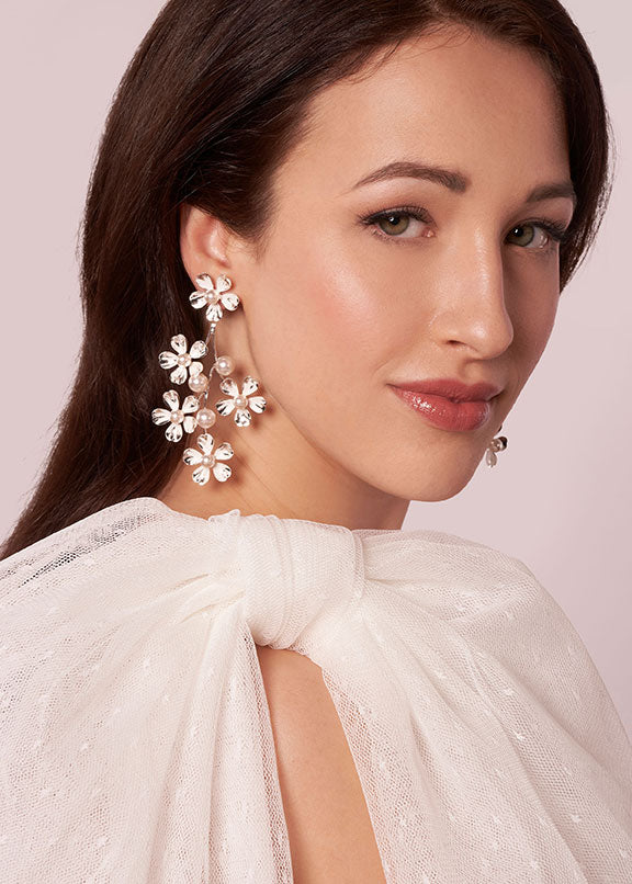 hand silver painted floral chandelier earring with pearl accents on model side view 