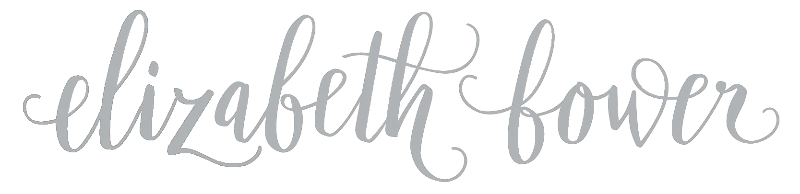 Silver 'elizabeth flower' text on a white background