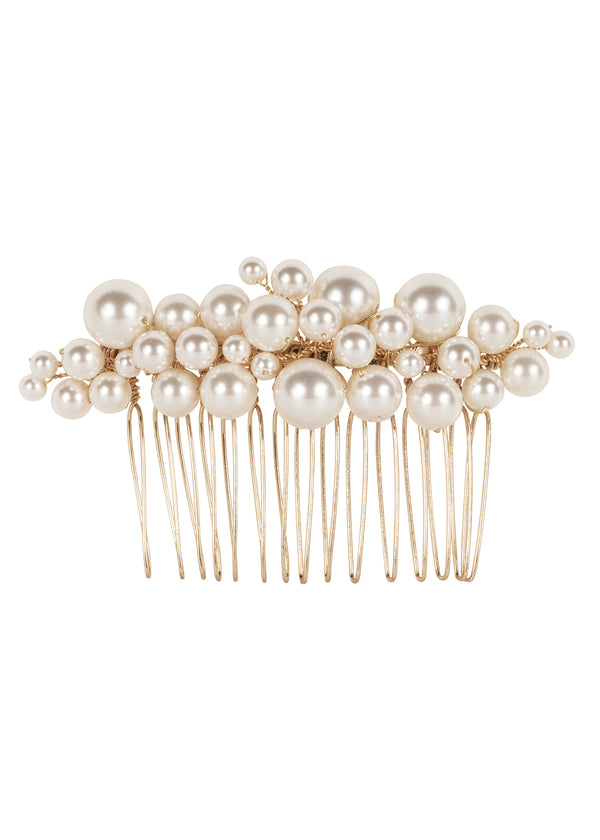 A gold and clustered pearl hair comb on a white background 