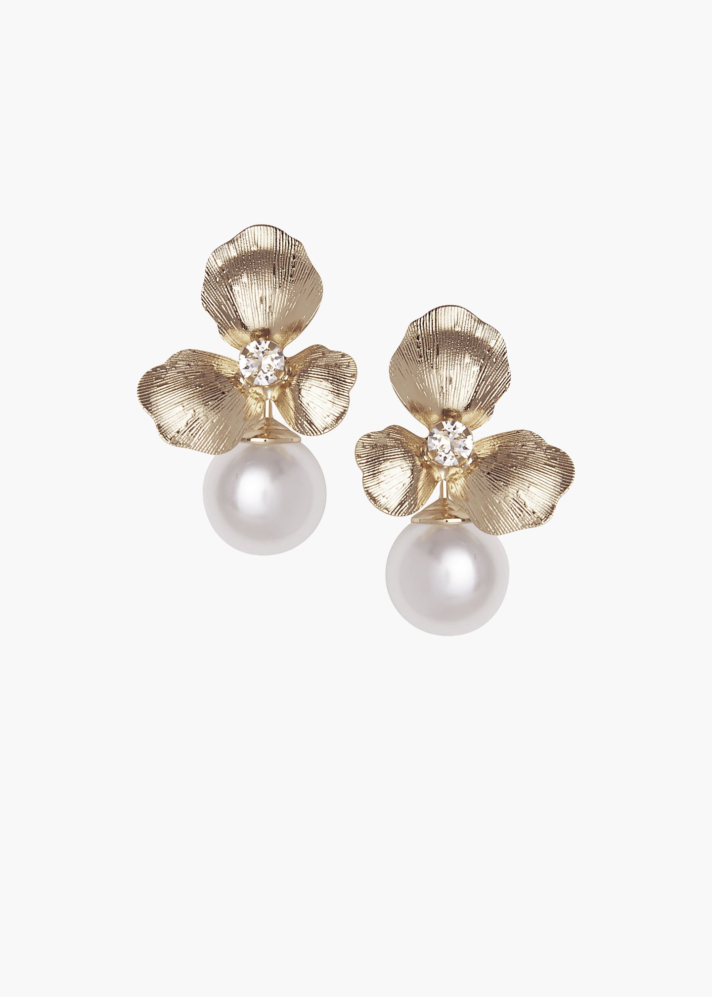 Floral gold studs earrings with an accent pearl against a white background