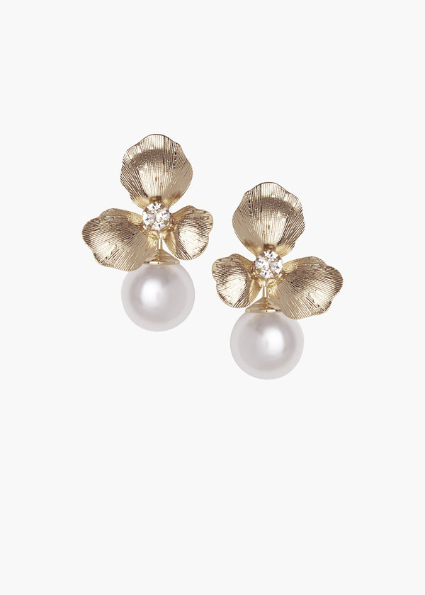 Floral gold studs earrings with an accent pearl against a white background