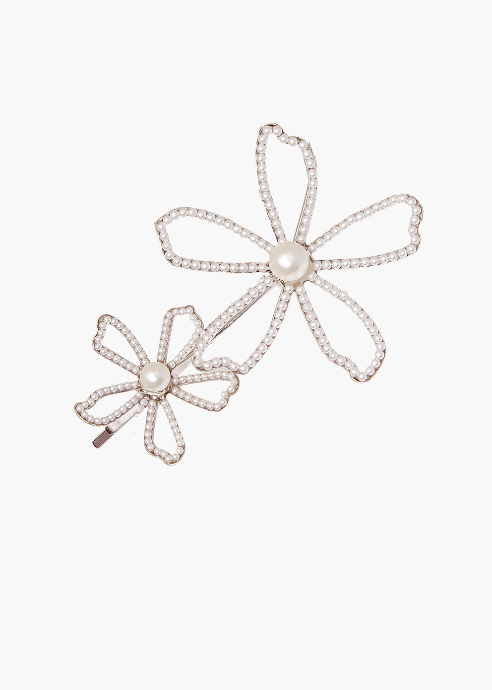 Pair of flower-shaped hairpins with pearl centers on a white background
