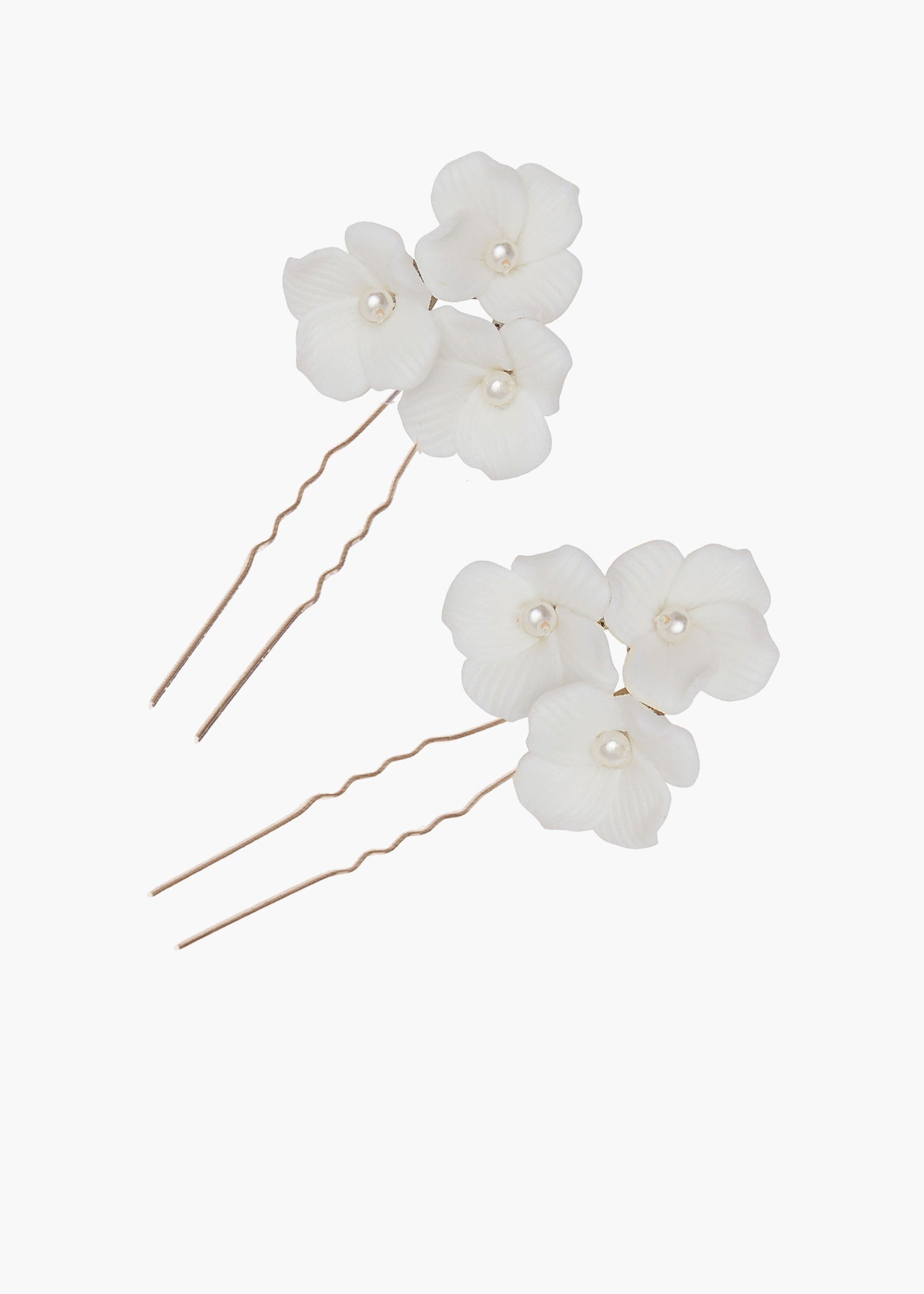 Floral hairpins with pearls on a white background