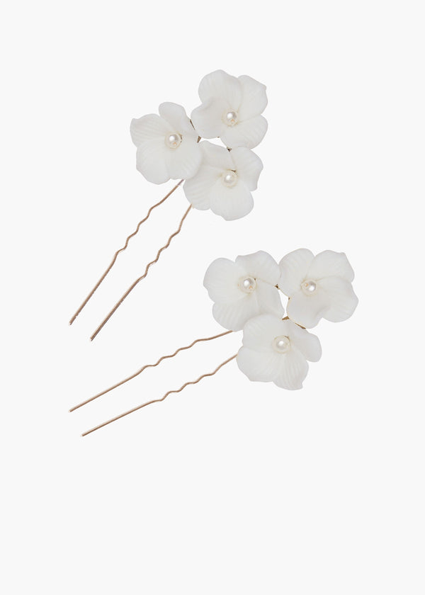 Floral hairpins with pearls on a white background