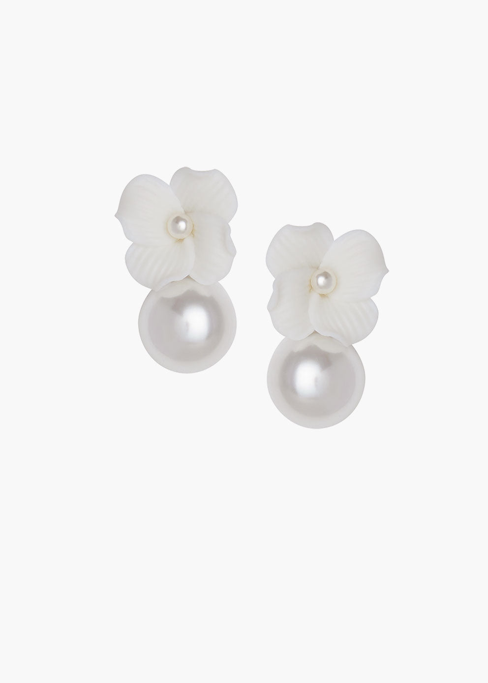Pair of white floral earrings with pearl centers on a white background