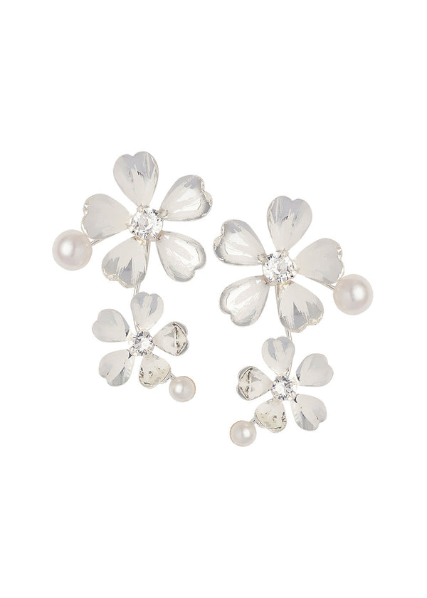 Double flower earring with pearls in silver on white background 