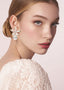 large gold floral flower stud with Swarovski tear drop accent on model in lace dress