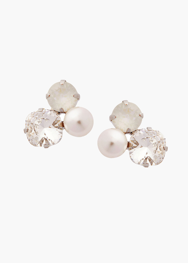 Pair of earrings with pearls and crystals on a white background