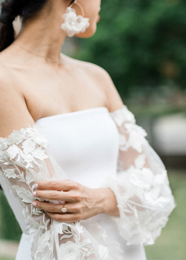 Silk floral hoop earring on model in lace wedding dress
 