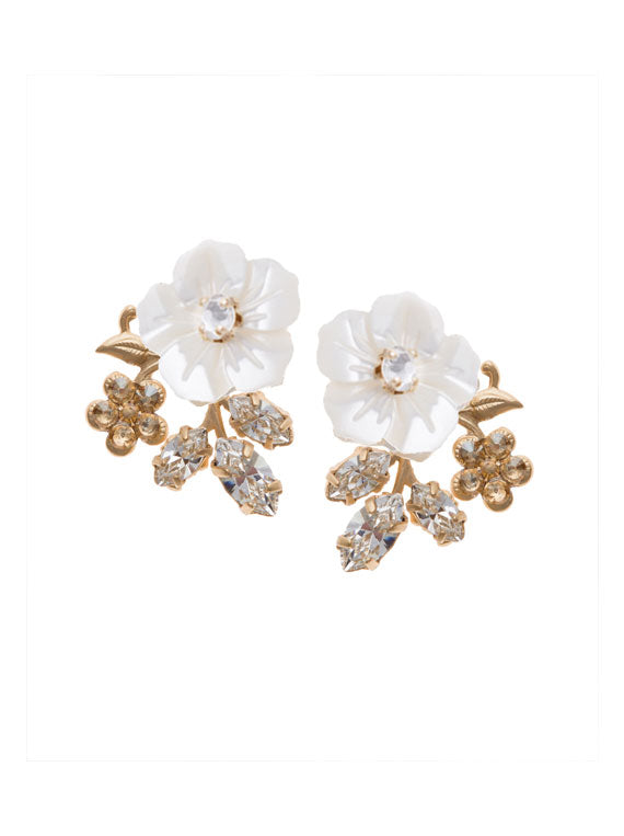 A pair of floral stud earrings accented with crystals and a carved mother of pearl flower. 