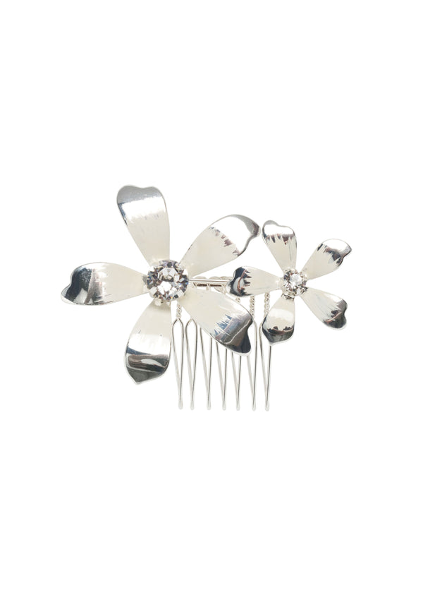A double floral hair comb in silver on a white background. 