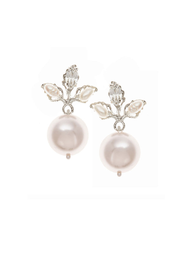 A pair of pearl earrings with floral crystal embellishments on a rhodium plate finish.
