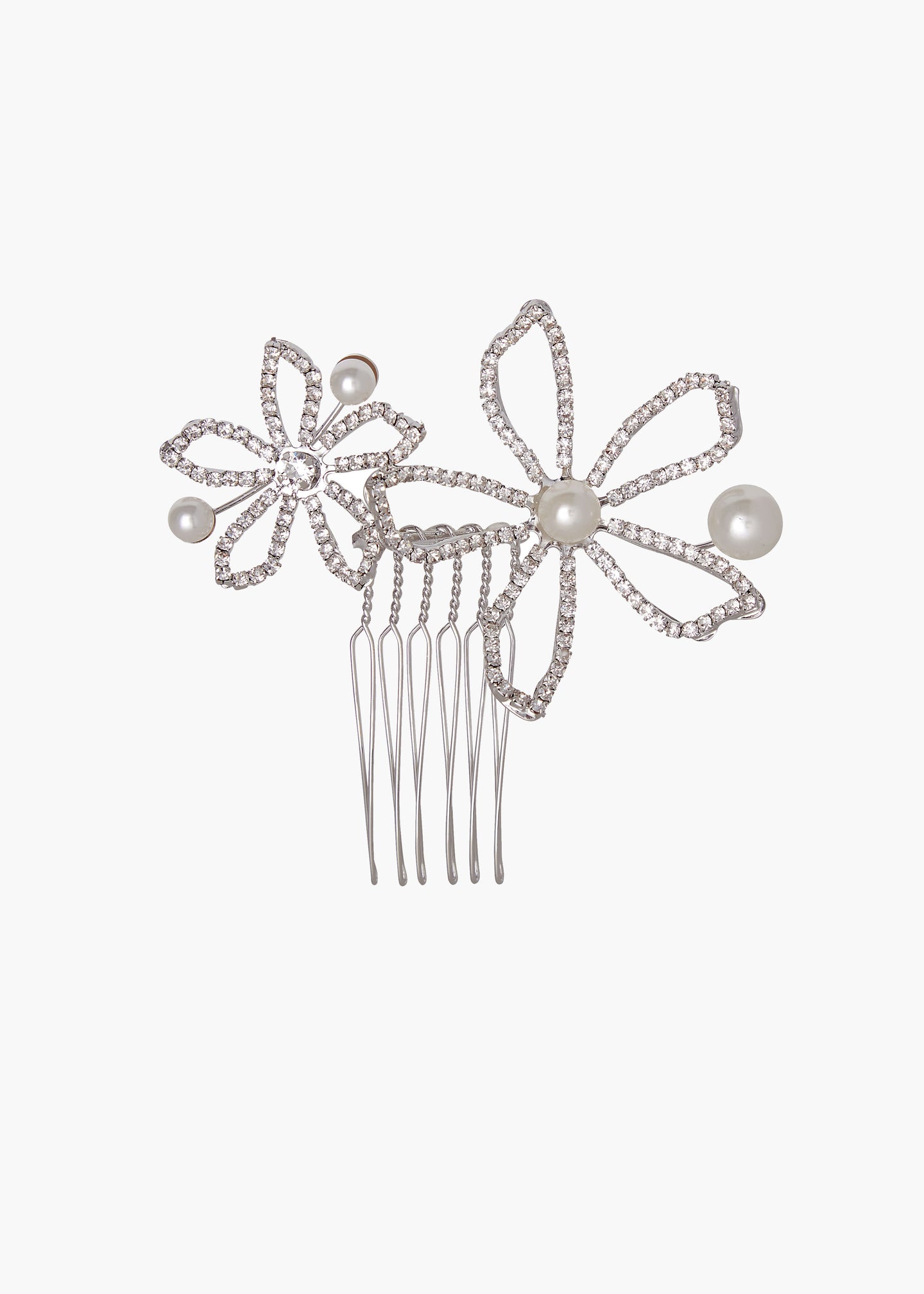 Silver hair comb with floral designs and pearls on a white background