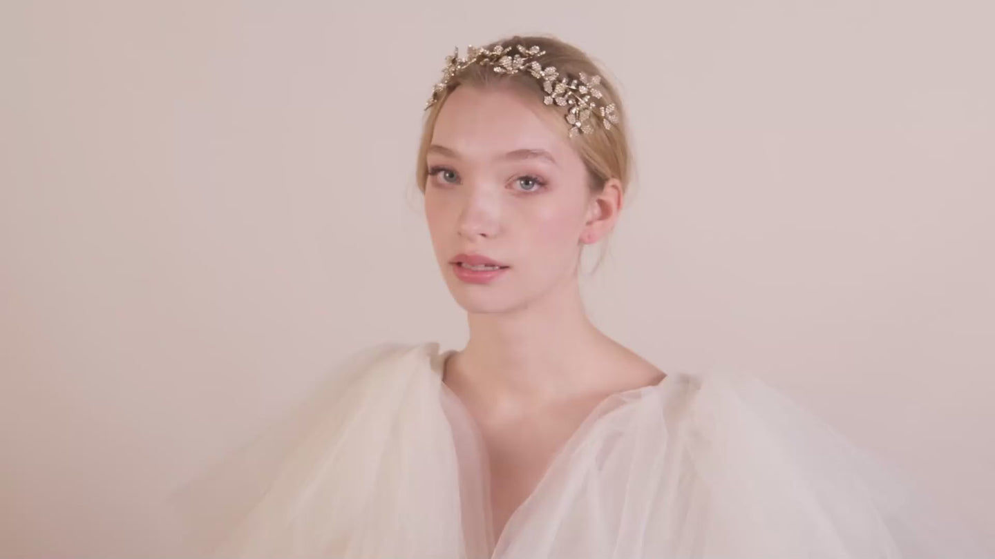 Gold floral crystal wedding hairband on model in tulle dress