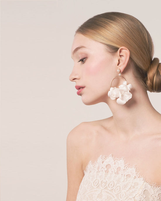 silk floral hoop earring on model in lace dress portrait (side view)