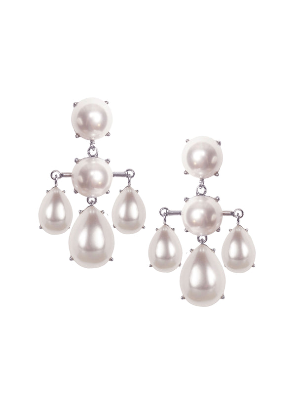 A Pair of silver and pearl chandelier earrings on a white background
