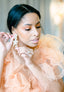 Cascading silver Swarovski floral chandelier on model in tulle dress