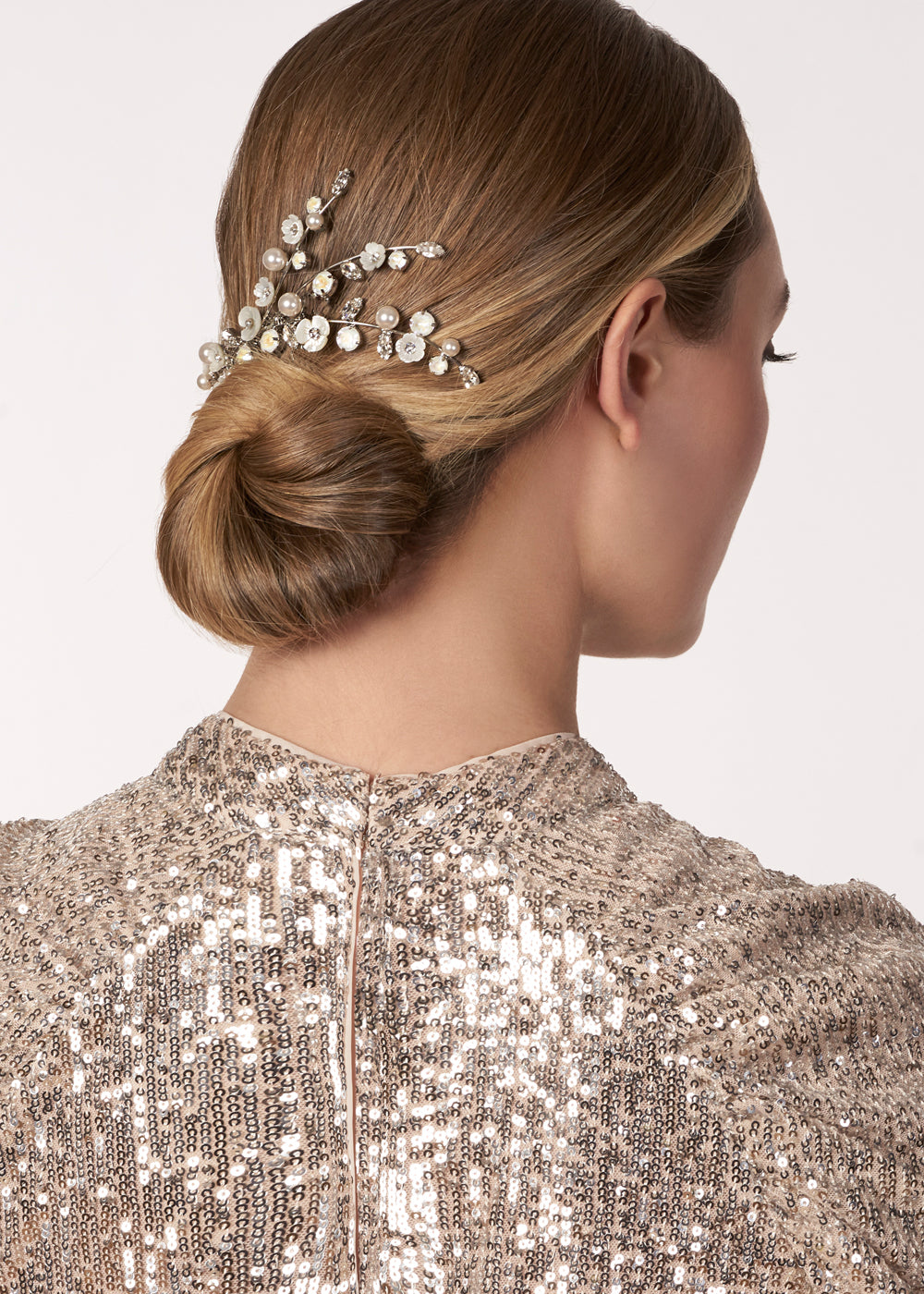 Mother of pearl floral bridal hair comb on model (side view)