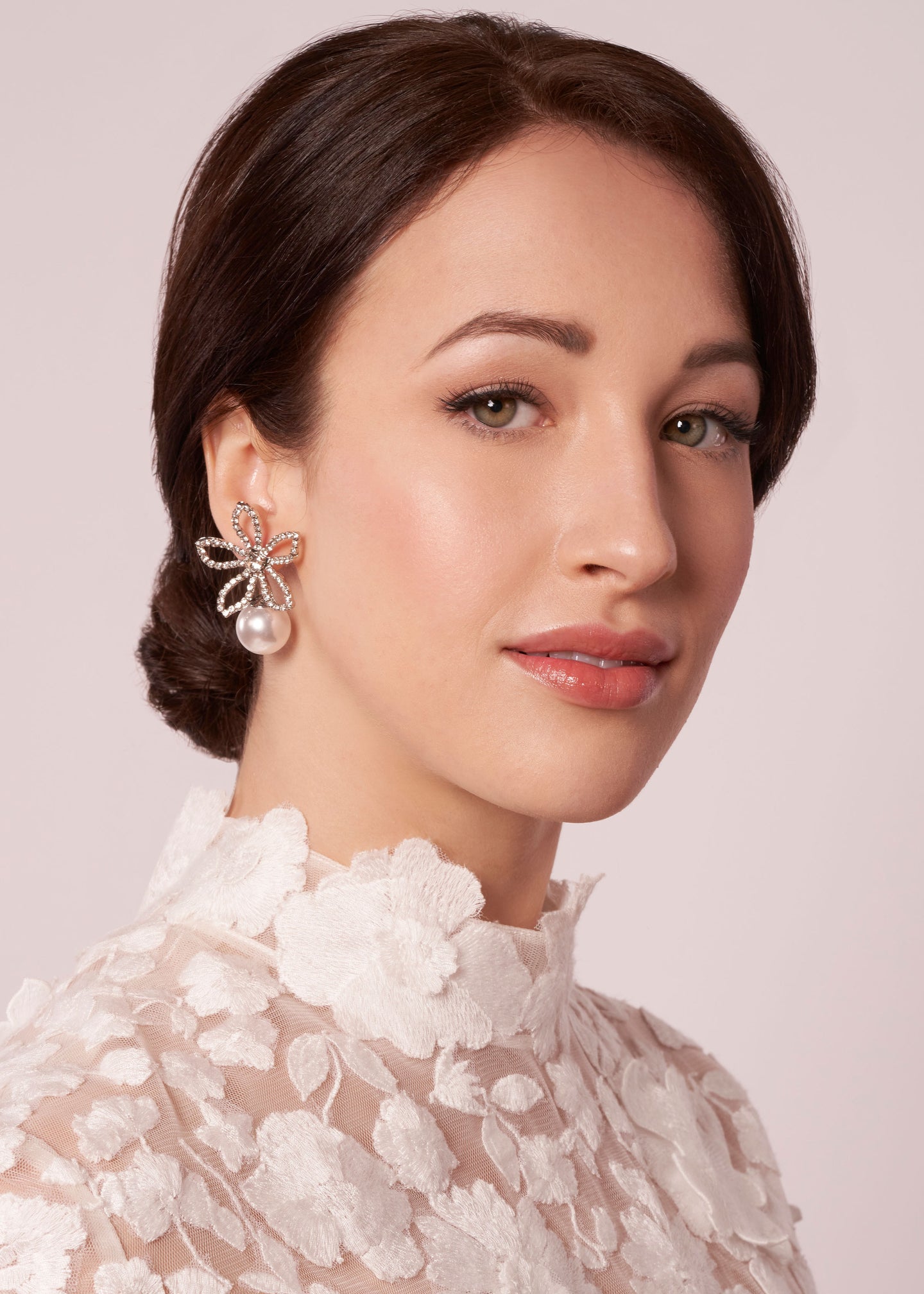 Floral Swarovski crystal and pearl stud earring on model in lace dress (portrait view)