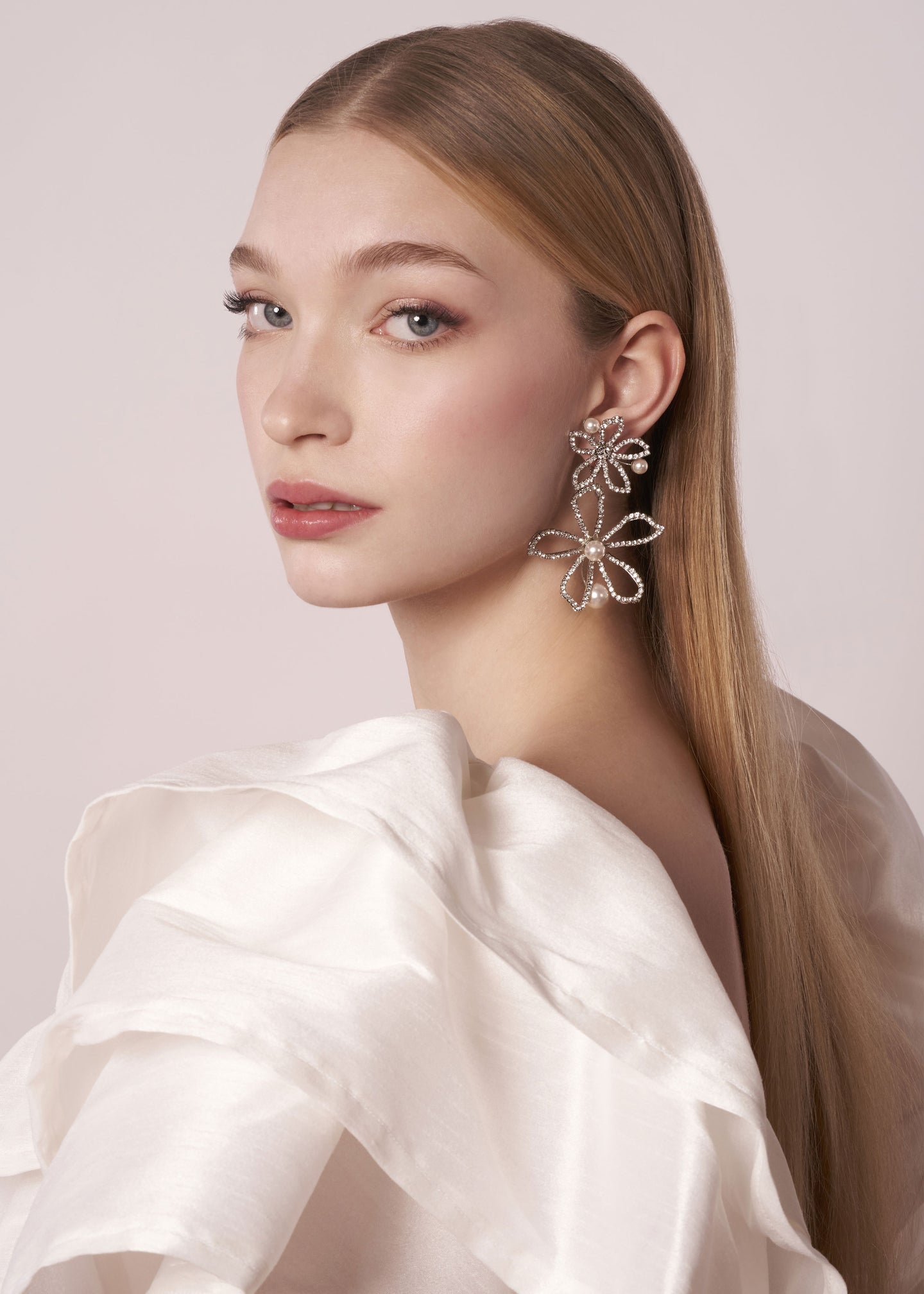 Statement earring Swarovski crystal and pearl double flower on model (side view)