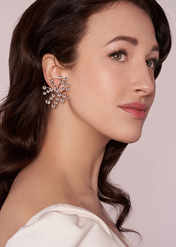 Crystal spray stud earring on model side view 