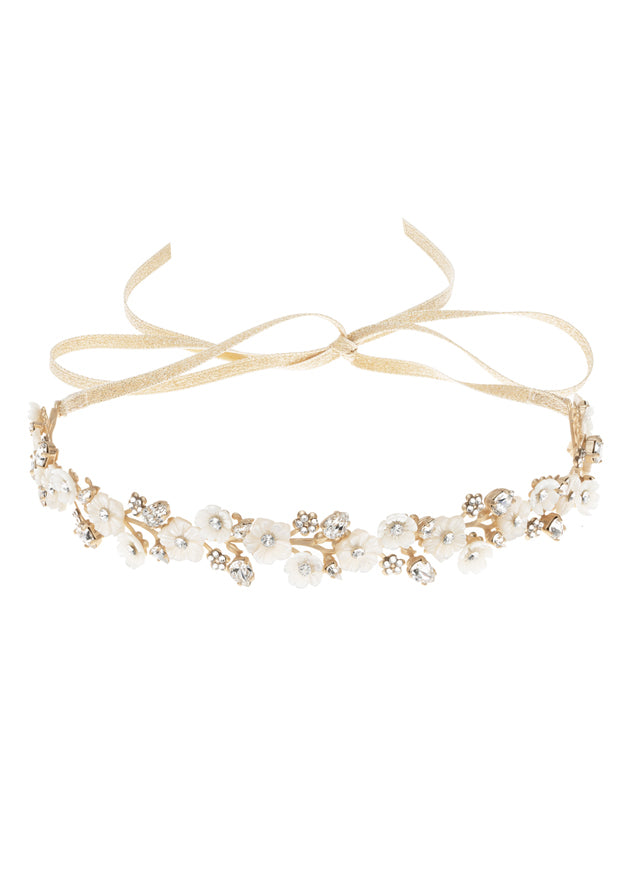 Golden floral wedding hairpiece  with mother of pearl flowers laid flat on white back ground 