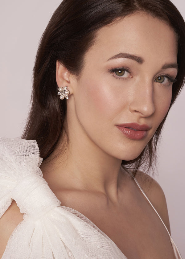 Swarovski pearl and crystal gold stud earring on model side view 