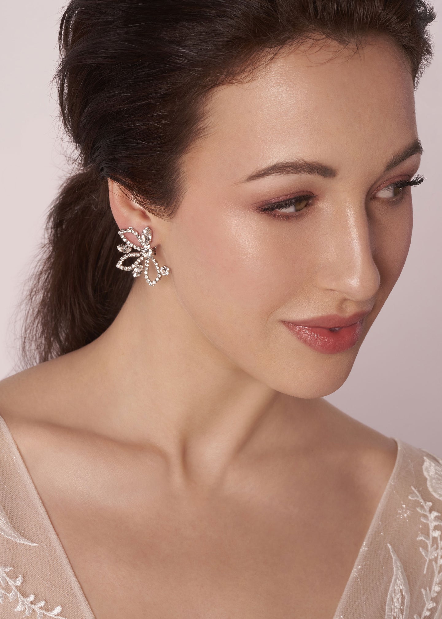 Silver Swarovski crystal left right wing style stud in gold on model 