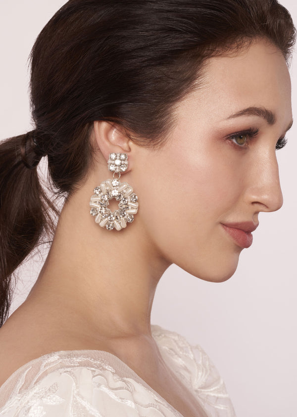Embroidered pear and crystal shield earring on white back ground 