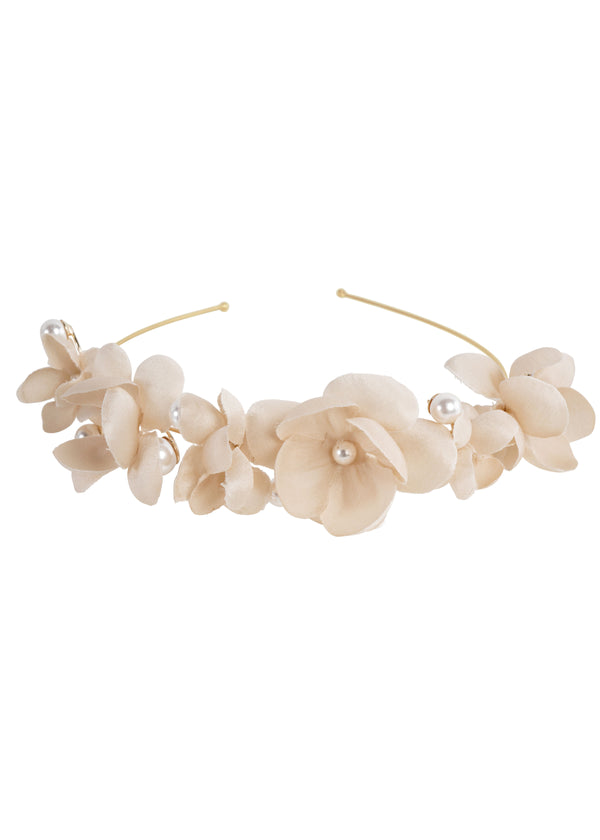 A hairband featuring hand sewn silk charmeuse flowers with oversized pearls, with a gold plate finish.