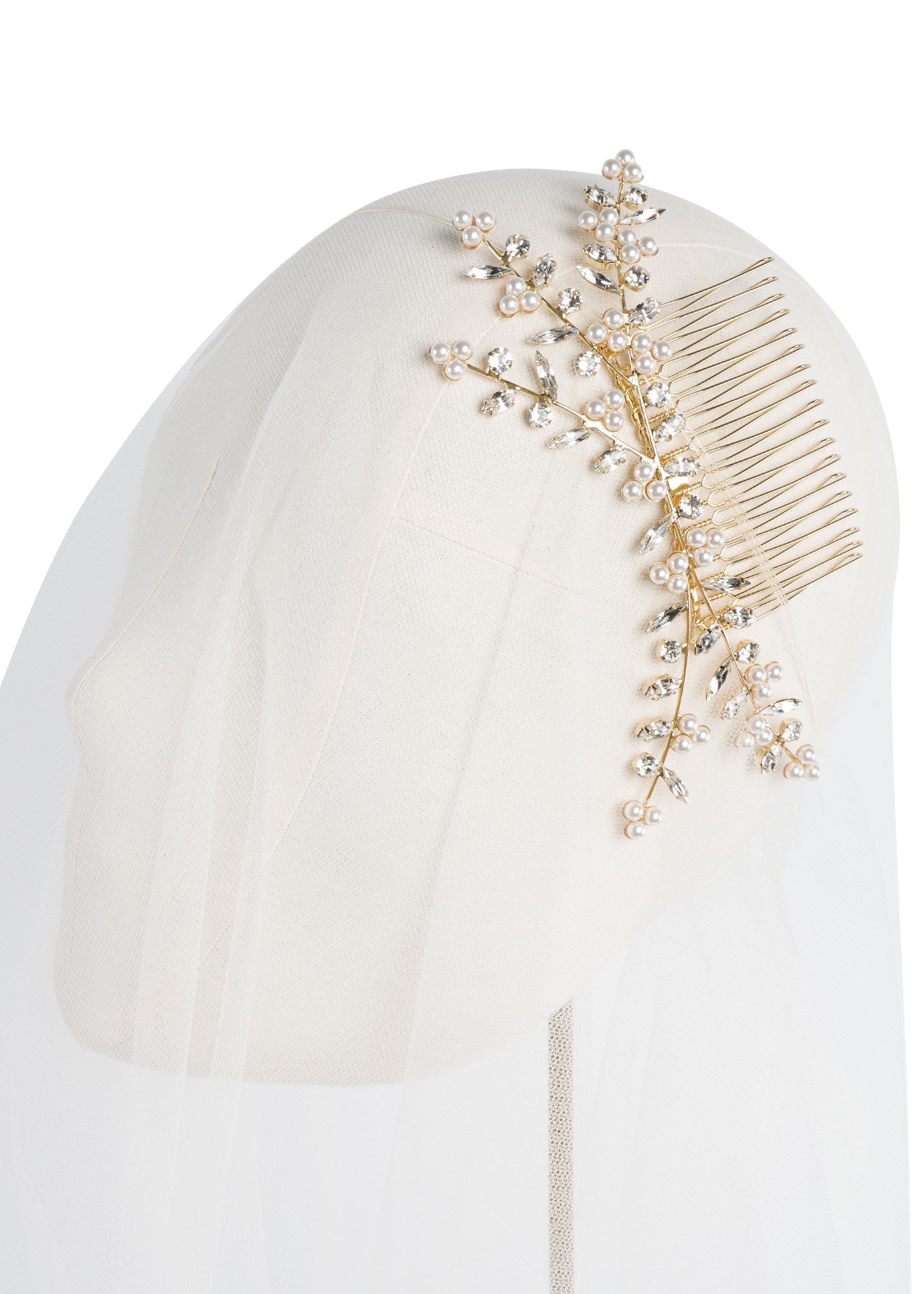 Gold Crystal and pearl branch style bridal hair comb on headstand with tulle 