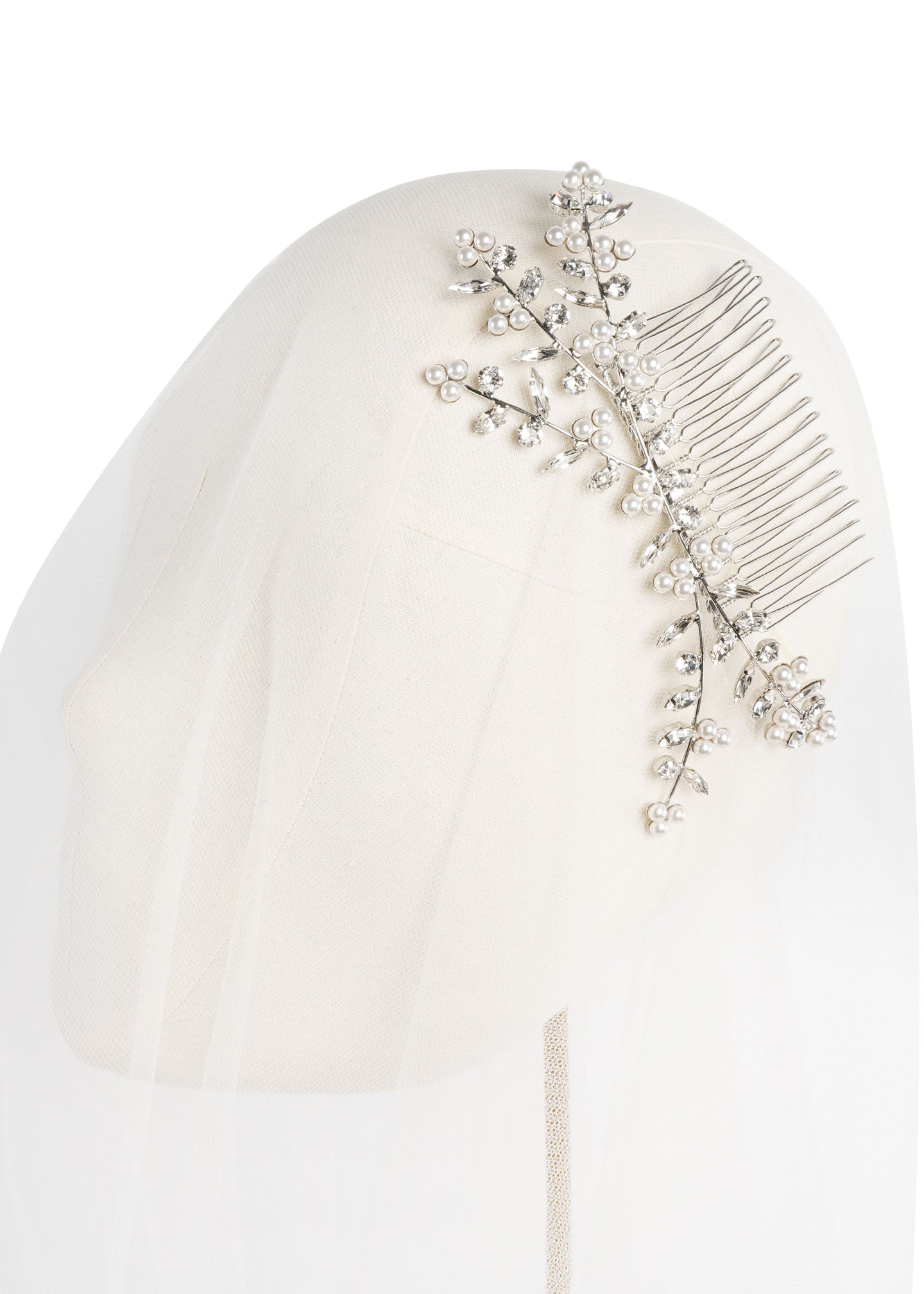 Silver Crystal and pearl branch style bridal hair comb on headstand with tulle 