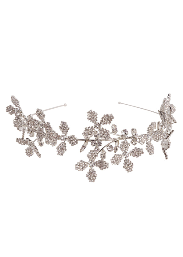 Silver floral bridal hairpiece laid flat on white background