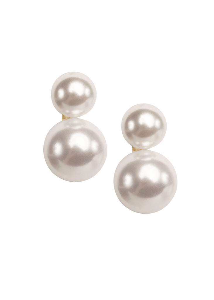 Double pearl stud gold earring on white background 