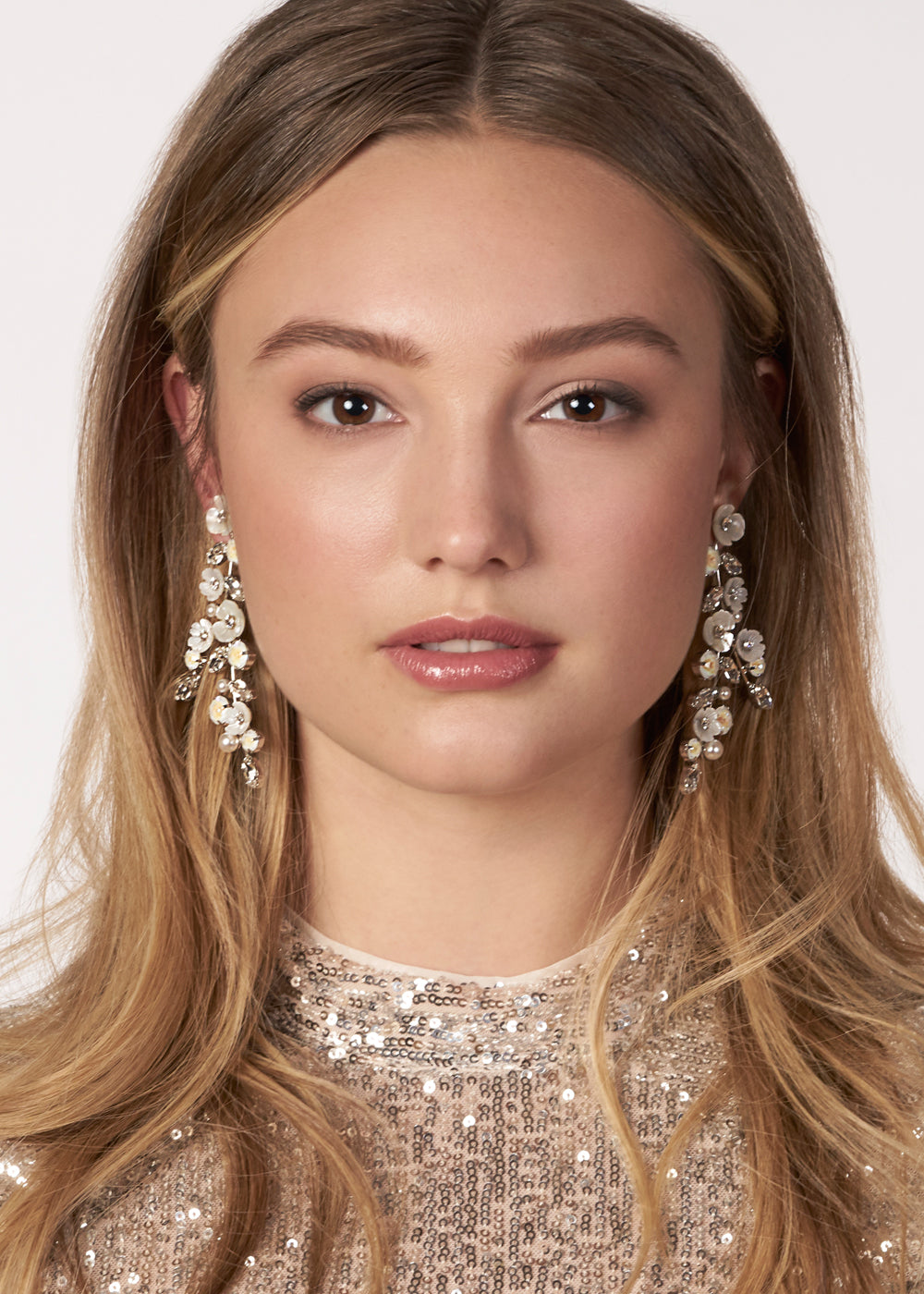 floral statement chandelier earring on  in sequin dress (front view)