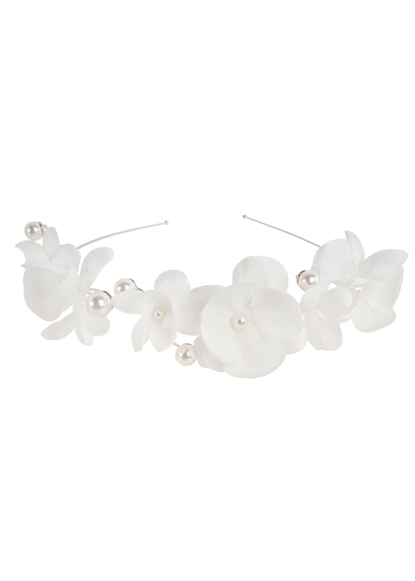 A hairband featuring hand sewn silk charmeuse flowers with oversized pearls, in a rhodium plate finish.