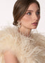 Gold crystal double flower earring with pearl accents on model side view 