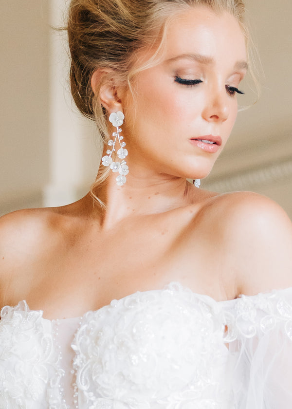 Cascading floral mother or pearl floral earring in silver on model