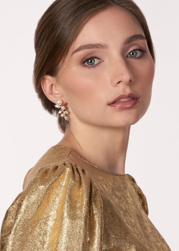 Gold Pearl stud with crystal accents on model side view 
