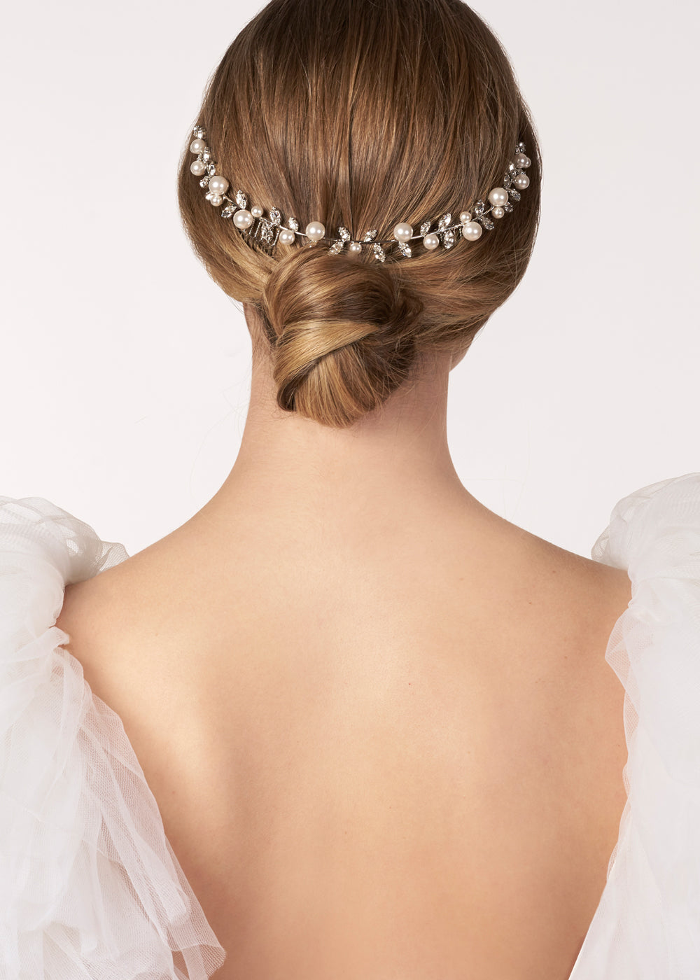 Silver pearl and crystal garland wedding hairpiece on a model (back view)